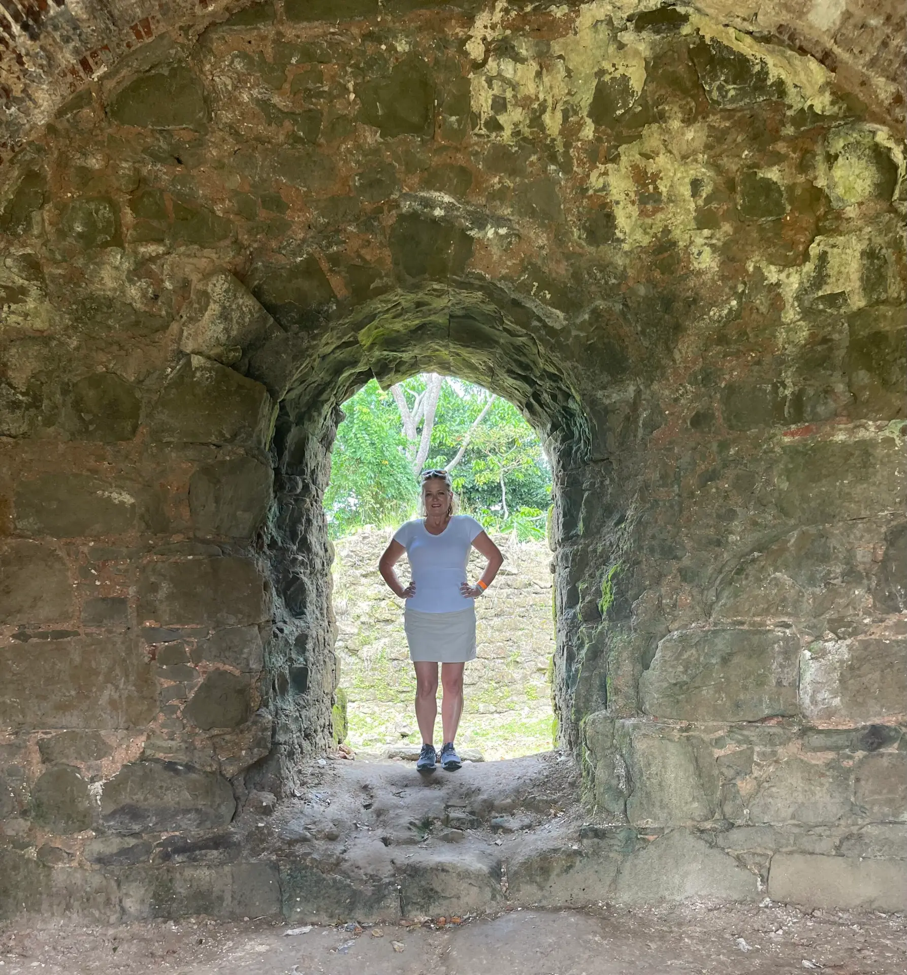 Anne Marie standing in an archway of the Panama Viejo ruins