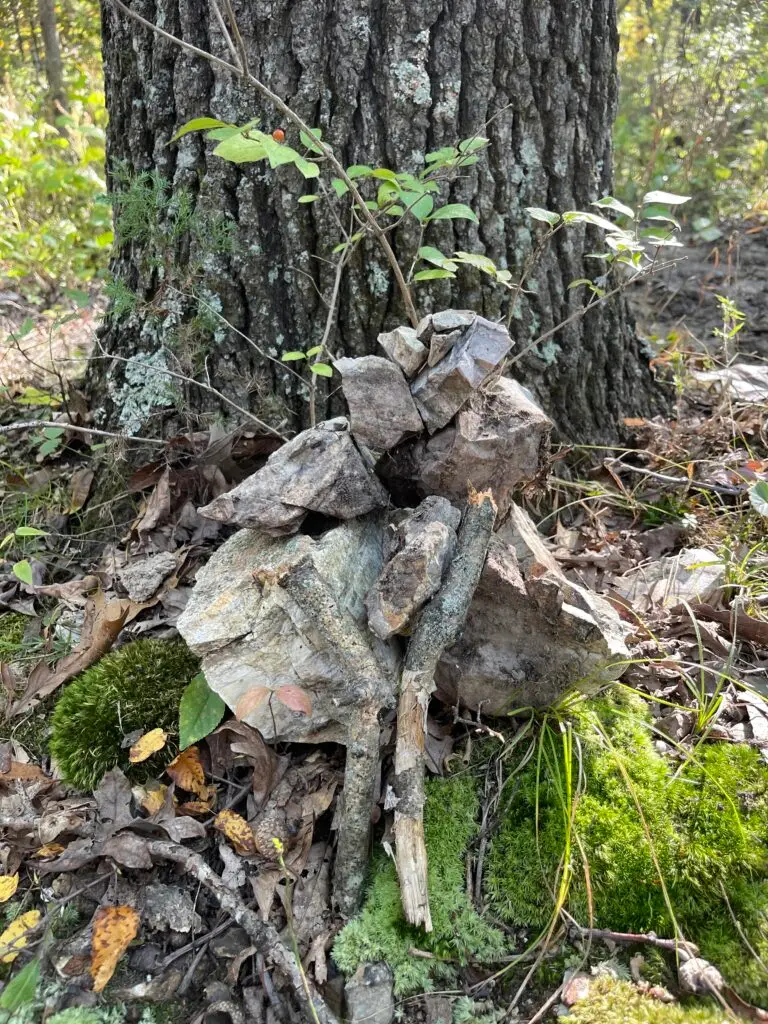 Photo of stones stacked in a pile. Some might see an angel, a butterfly, or a fairy. Or they may just see a pile of rocks. It's up to their artistic interpretation.
